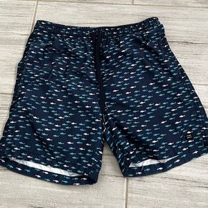 Blue swim trunks with little shark emblems from SPLIT, size S